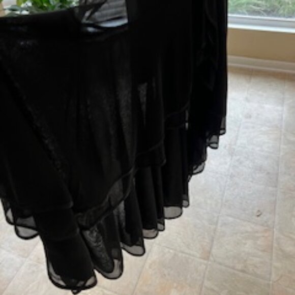 Black formal girls dress with multiple layers of sheer ruffles at the bottom. - Picture 2 of 7